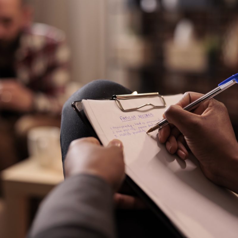 Male psychologist taking notes at couple therapy session to help with relationship issues, counselor giving advice. Explaining marriage problems, using paper to do psychoanalysis. Close up, SSUCv3H4sIAAAAAAAAA41Sy27sIAz9F9aDFMiDZH6l6sKAM4OahAjIbUej/Ps1MFKrrsrKPjbH9rGfzFl2ZZOapFKAvBu04h0o5FMjDG97rVrVjYMaO3ZhFhKyq2jbRgjZq2noyaR3YRqiM+z6ZG5ZjpgCJOc3dqVIwM1iKCZal3xwsJB3XlhMkI6IMX+L9yMlDDF581FywXqN364NCGtMbsXiPuCxOhN8cYRsw1yzcPfRpf3uk48FMbAVkgIVZPeb7WvML/4I2n/Vggusj5rhvhIUa/V5DFxwxS1VQnwgrq9g/FlJu9vPSuLMxRPeaOA64kuit2fGSXPSMx46G+flj9g7tXnDzVCfz/PM2i4IRcE31s6ym5vecAXTxDvaDte6MdxYaGTXNQjzSFQKGtSymTnafuTdLCcOI0g+oZAa5mEYRU4bLDGIaeTSQMu7RjZ8nJTl0CohrZYg7MyonY9P2tqa56N2fLrnTVPj/thSeNTmF+930AstboYl4oXdIUZKsC+APu7BGbfdKouh+/FrtTef8nRFgyyus69S9XbujtBc58mOffFg0Ralf61i6Iehl2KUZ5FydXRqtvIE/Ofw85vnPM//Tiv1SxMDAAA=